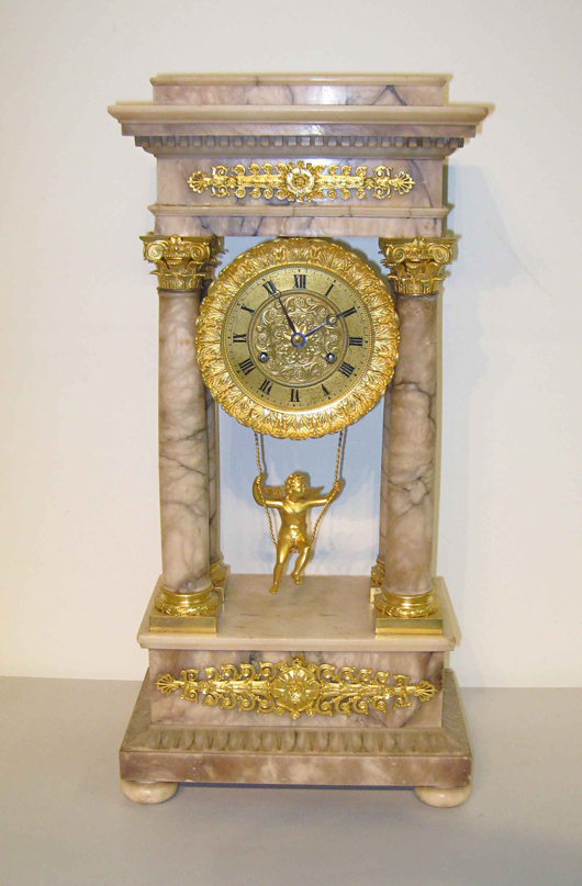 Marble and applied gilt French portico clock with an angelic cherub on a swing as a pendulum. Image courtesy of Gordon S. Converse & Co.